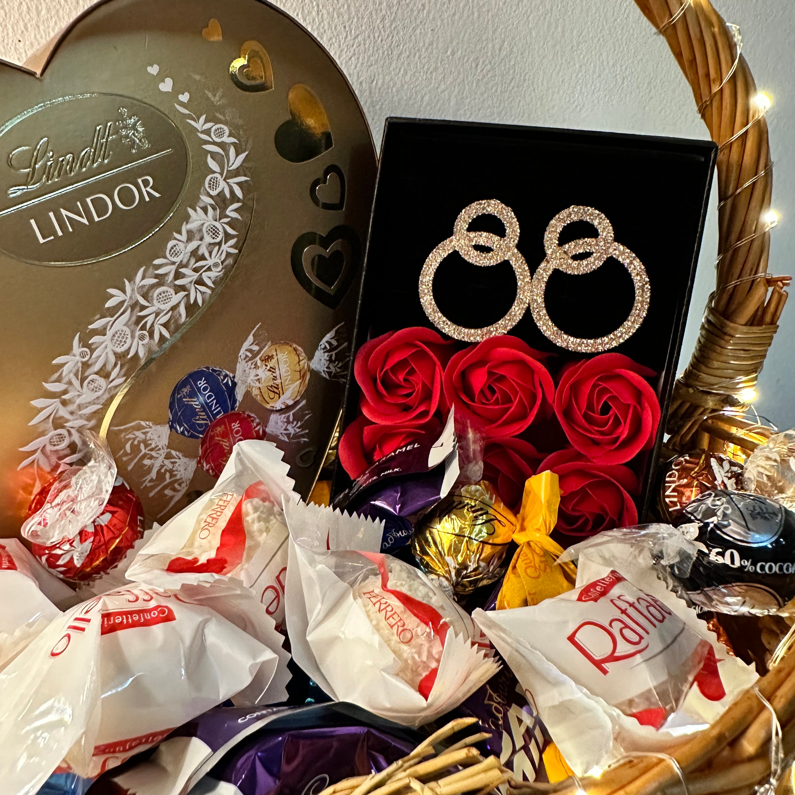 Valentine's Bliss Bucket: A Symphony of Sweets, Chocolates, Dazzling Earrings, and LED Elegance - A Perfect Gift of Love
